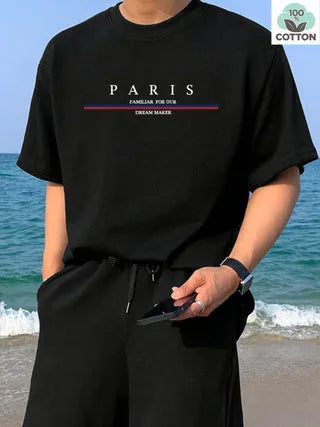 Man wearing a heavy loose-fit pure cotton T-shirt with a letter print on the chest in a casual setting.