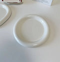 White porcelain chubby toot plate with bear doodle design, suitable for microwave use