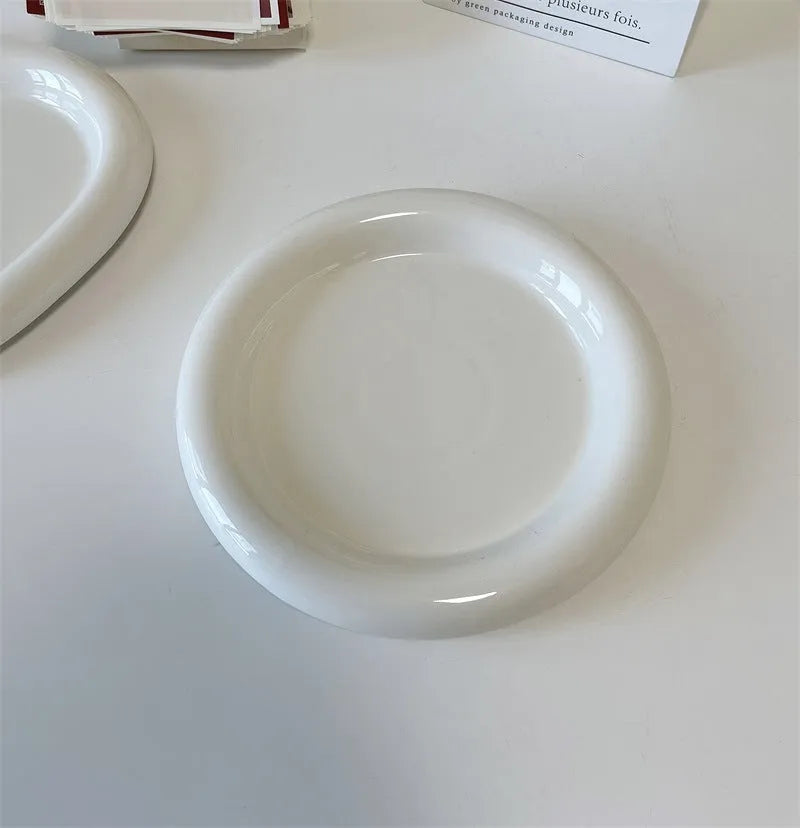 White porcelain chubby toot plate with bear doodle design, suitable for microwave use