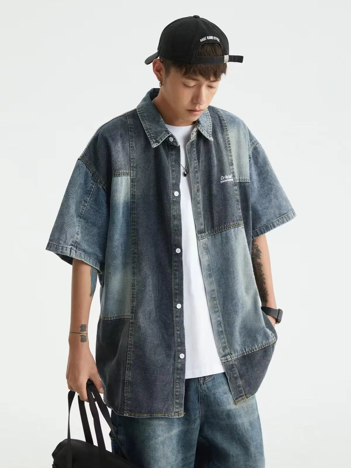 Blue men's denim shirt with washed stitching details and loose cardigan fit
