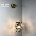 Modern glass wall lamp with silver or gold finish in 15cm or 20cm diameter options