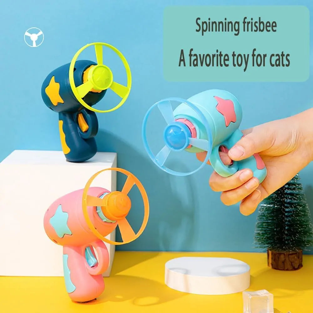 Blue or pink plastic cat toy gun with frisbee launcher for indoor feline play