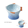 Blue ceramic fish-shaped cat bowl with tilted design and shallow eating surface on a plain background.