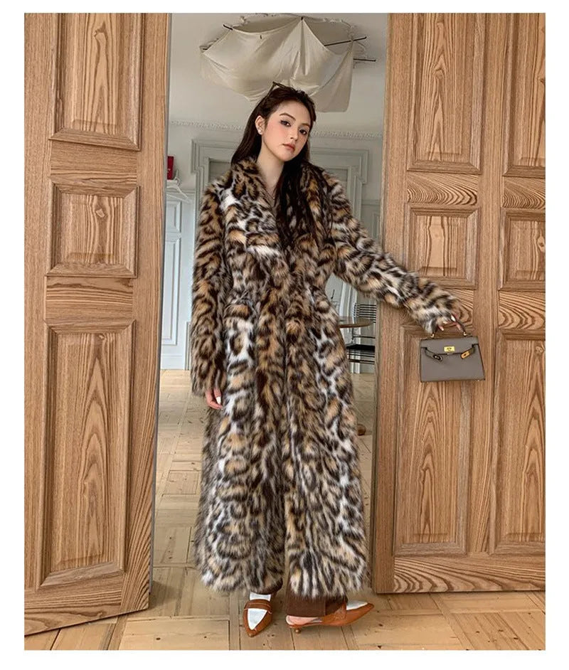 Faux fur coat with fur collar in long or mid-length style showing pocket details