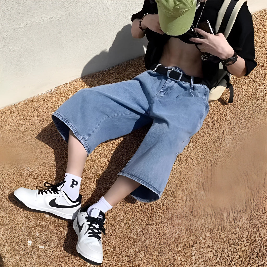 Men's blue washed denim cropped pirate shorts with a high waist and straight legs.