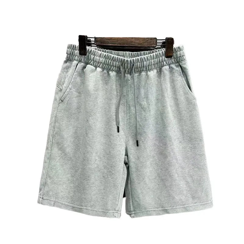 Men's cotton shorts with distressed detailing in straight-leg loose fit