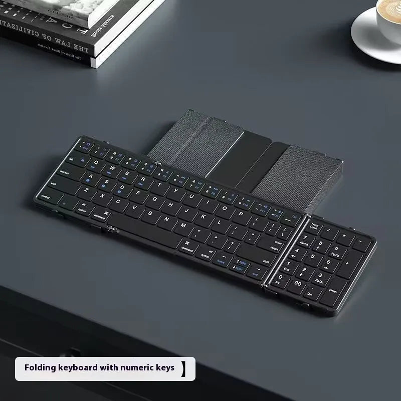 Black folding Bluetooth keyboard for mobile phones and tablets shown unfolded.