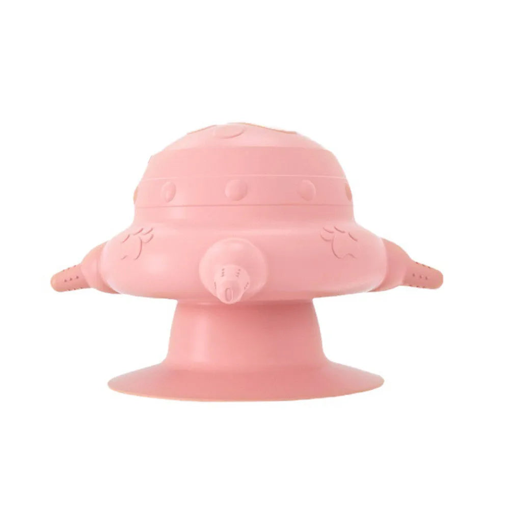 Pink silicone pet nursing device with milk bowl and four pacifiers for puppies and kittens.