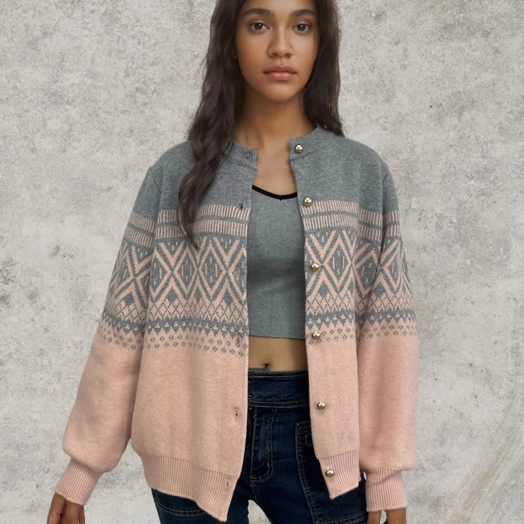 Red women's alpaca wool cardigan with grey diamond knit pattern and long sleeves.