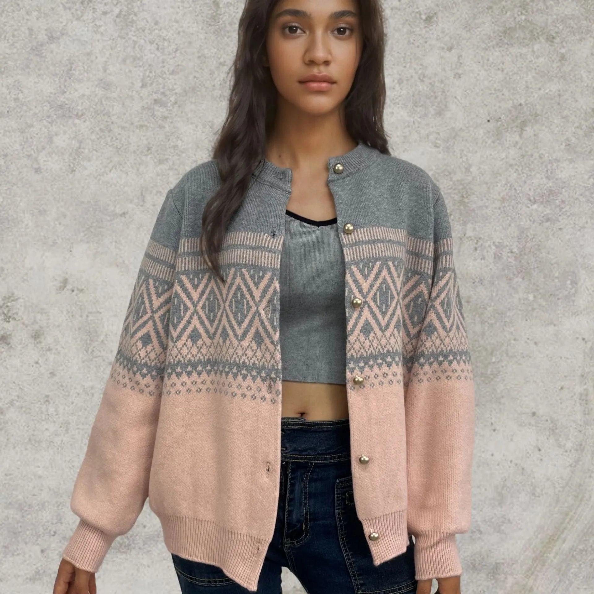 Red women's alpaca wool cardigan with grey diamond knit pattern and long sleeves.