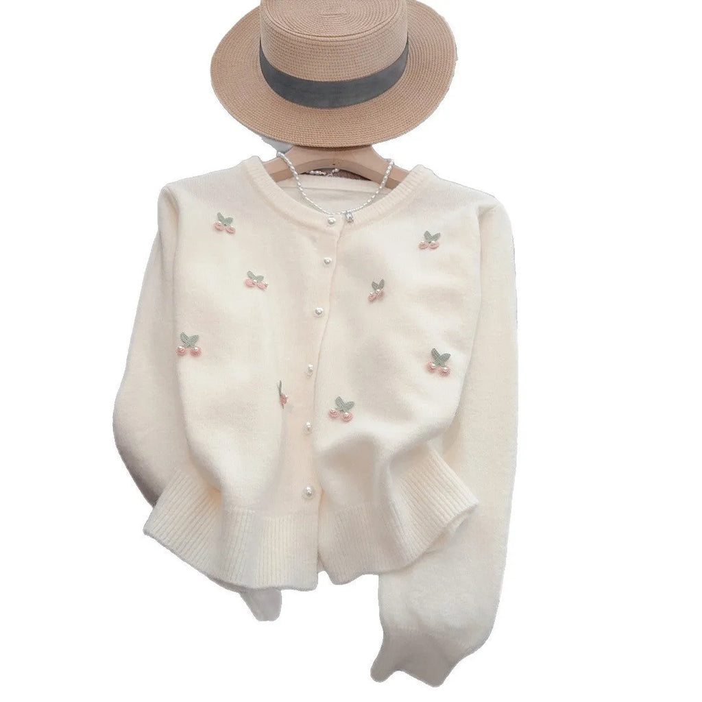 Soft pink French sweet style cardigan coat with beaded details and a round neckline.