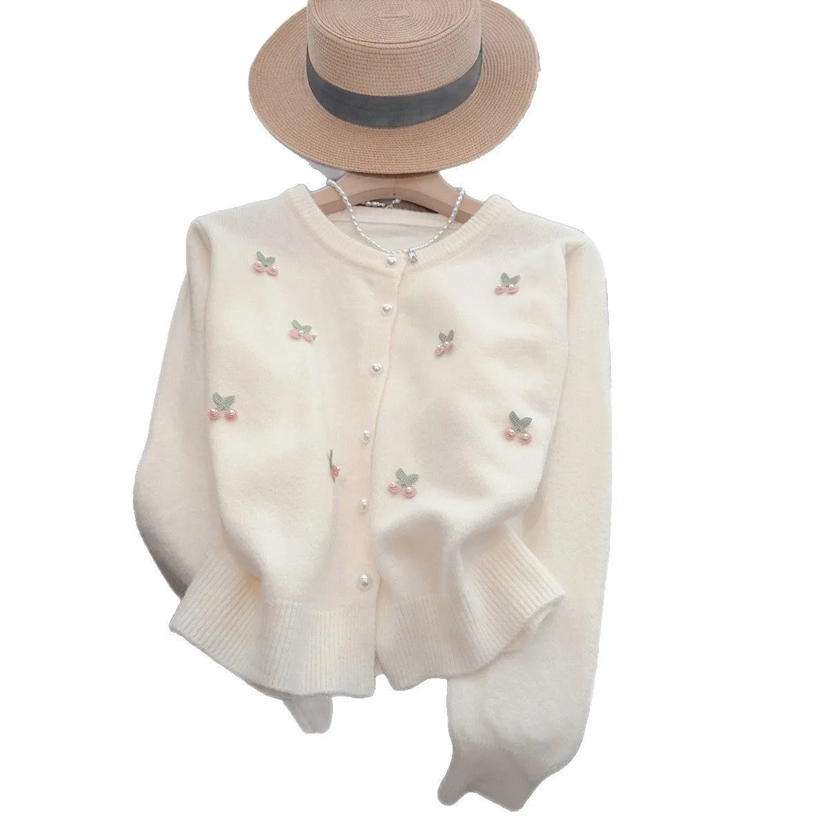 Soft pink French sweet style cardigan coat with beaded details and a round neckline.