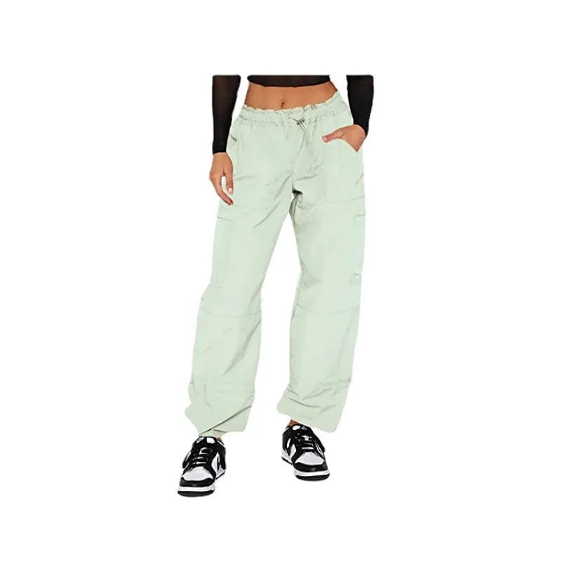 Men's straight-leg cargo trousers in khaki with multiple pockets, showing loose fit and mid-waist design
