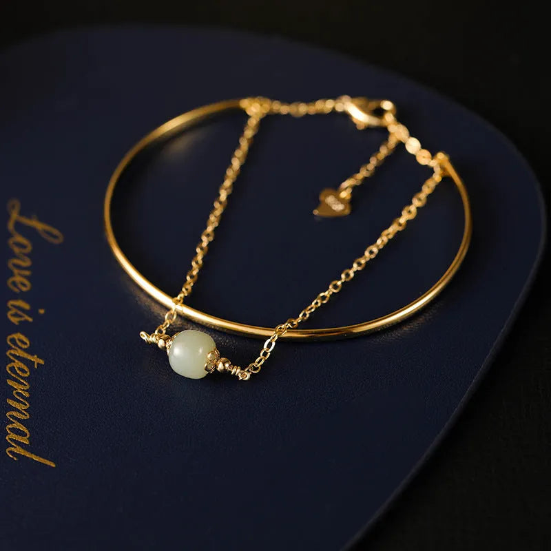 Women's jade bracelet with gold inlay detailing showing single, double and three bead versions