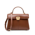 Black genuine vachette leather women's shoulder bag with clasp closure, showing square shape and adjustable strap.