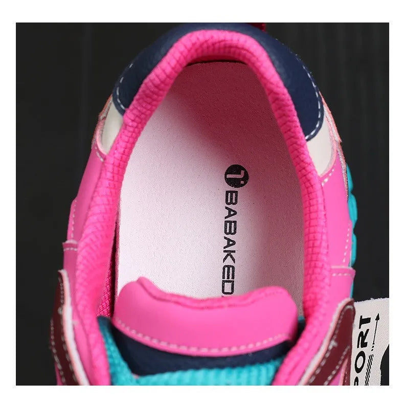 A pair of thick-soled leather casual shoes with a wedge heel and round toe in a lace-up design.