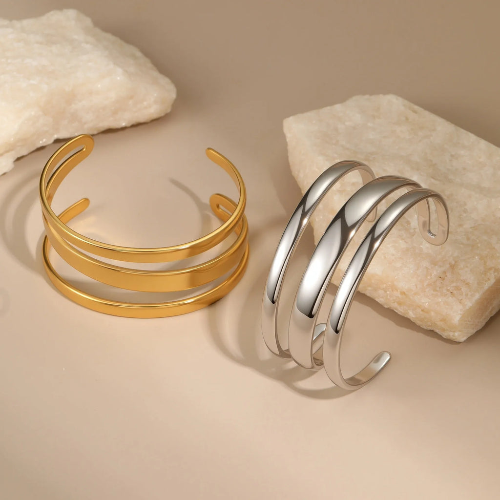 Stainless steel geometric line bracelet with simple opening clasp in gold or steel finish