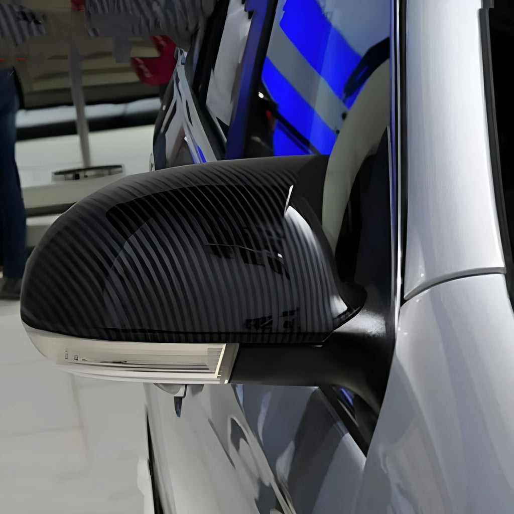 Pair of Horn Bright Black Volkswagen Sagitar exterior mirror housings for 2006-2011 models.