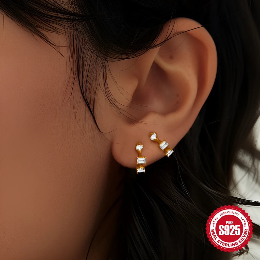Sterling silver geometric stud earrings with small round design elements in gold or silver finish