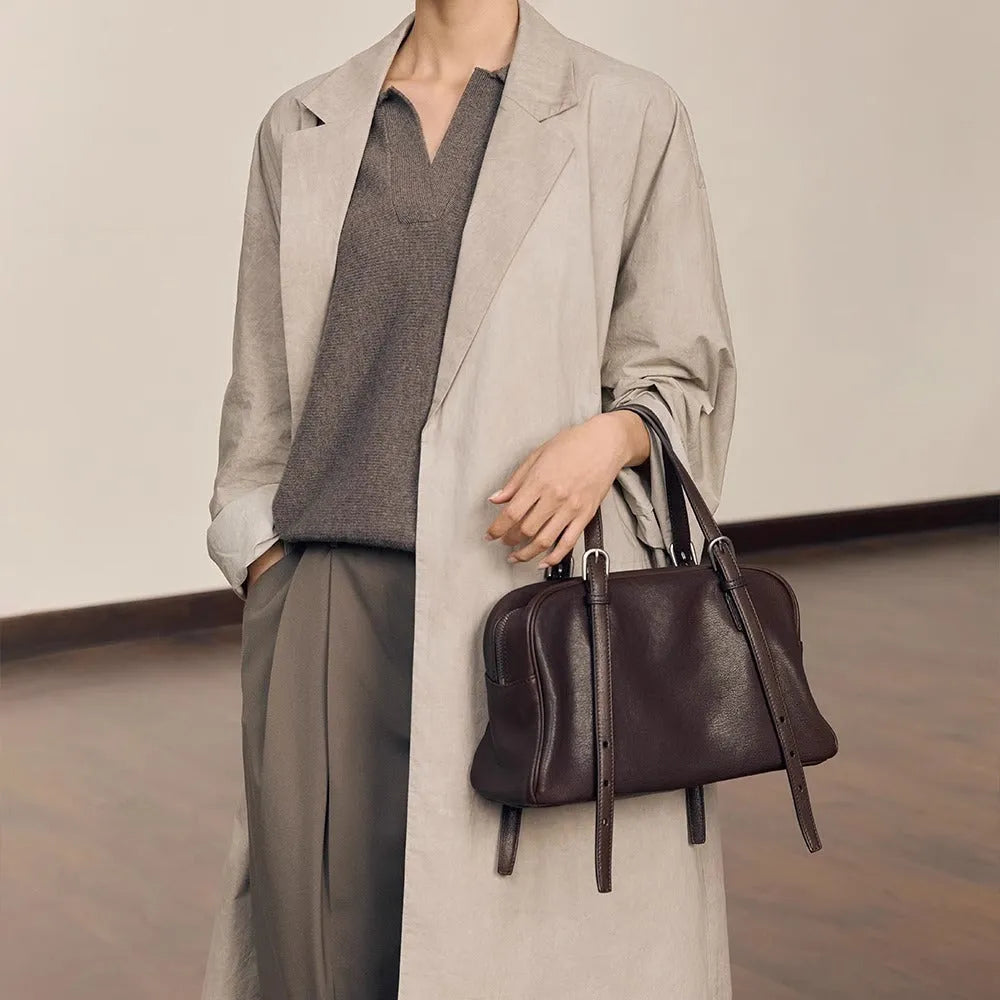 Women's genuine leather retro shoulder bag showing horizontal square design with double straps in black colour option.