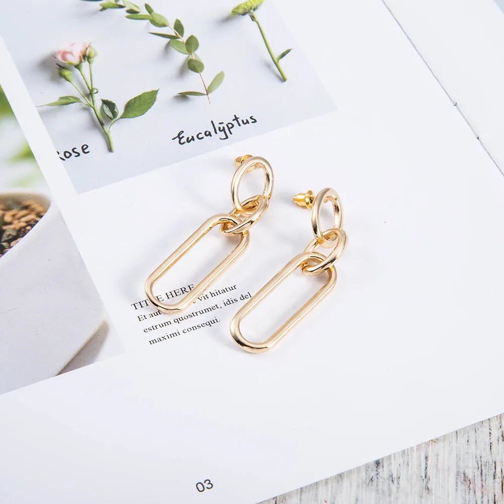 Sterling silver needle geometric hoop earrings with ring and line design elements