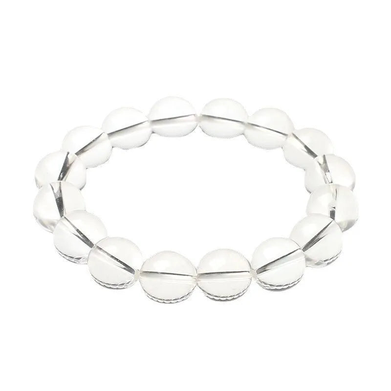 Natural white crystal bead bracelet with geometric design and round beads in various sizes.