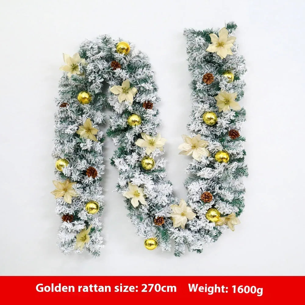 PVC Christmas rattan garland with flocking in golden colour, draped decoratively.