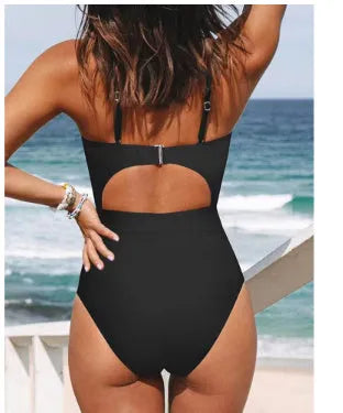 Women's black one-piece backless swimsuit made from polyester and spandex on a mannequin.
