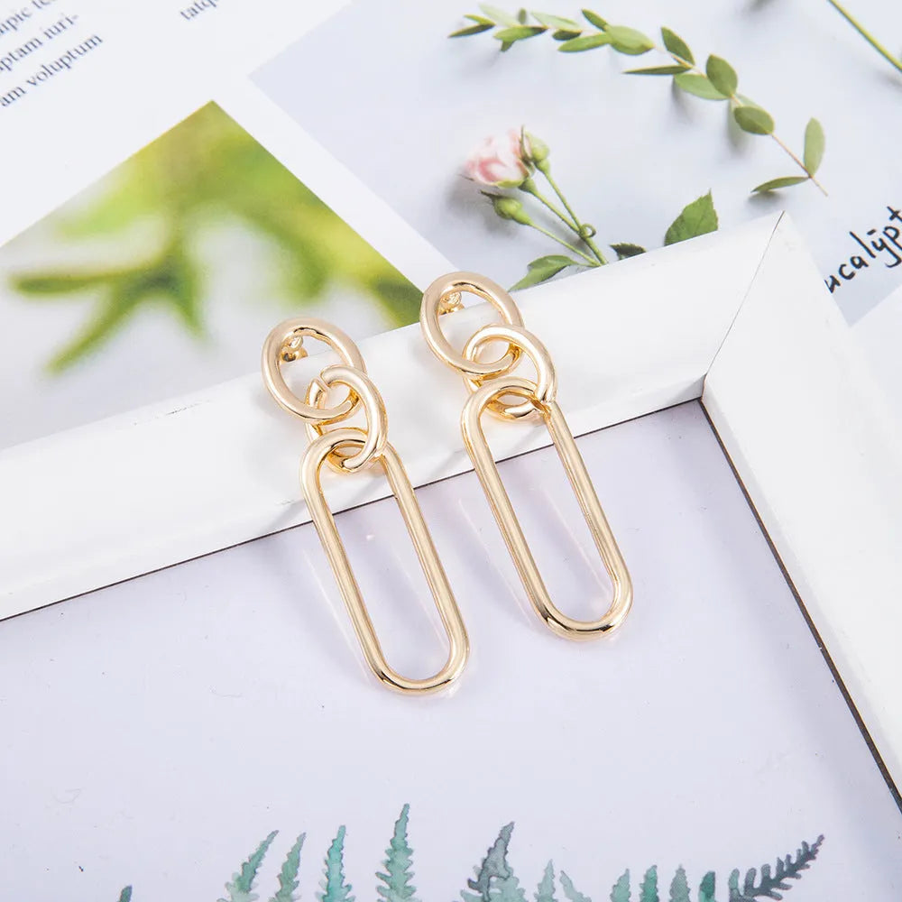 Sterling silver needle geometric hoop earrings with ring and line design elements