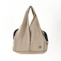 Apricot coloured cloth pet handbag carrier with dimensions 41 cm by 16 cm by 28 cm.