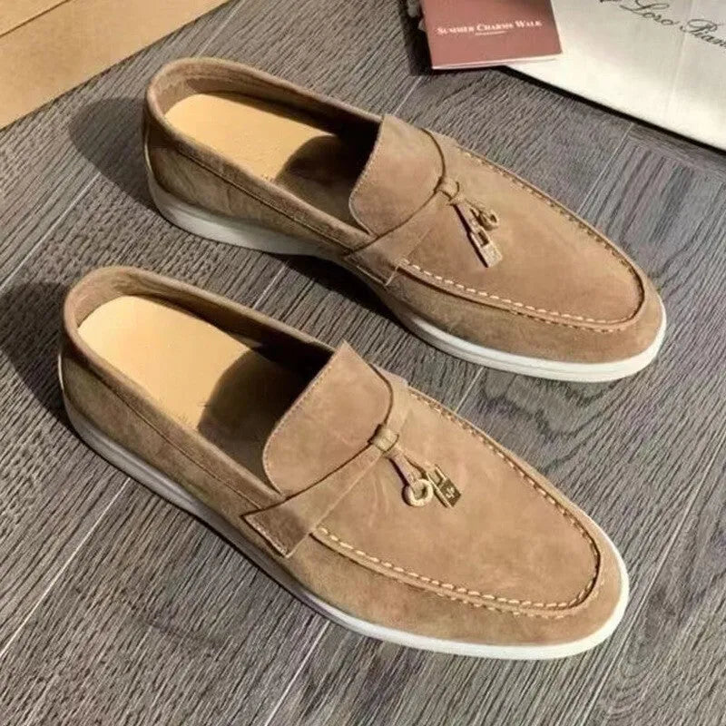 Unisex high-top slip-on loafers with a round toe cap and rubber sole on a neutral background.