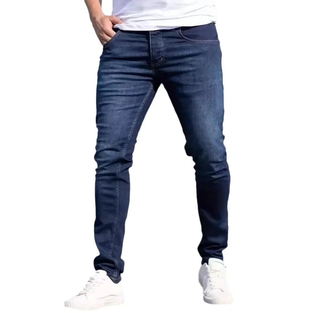 Men's dark blue slim casual jeans with skinny leg style and mid-waist cut