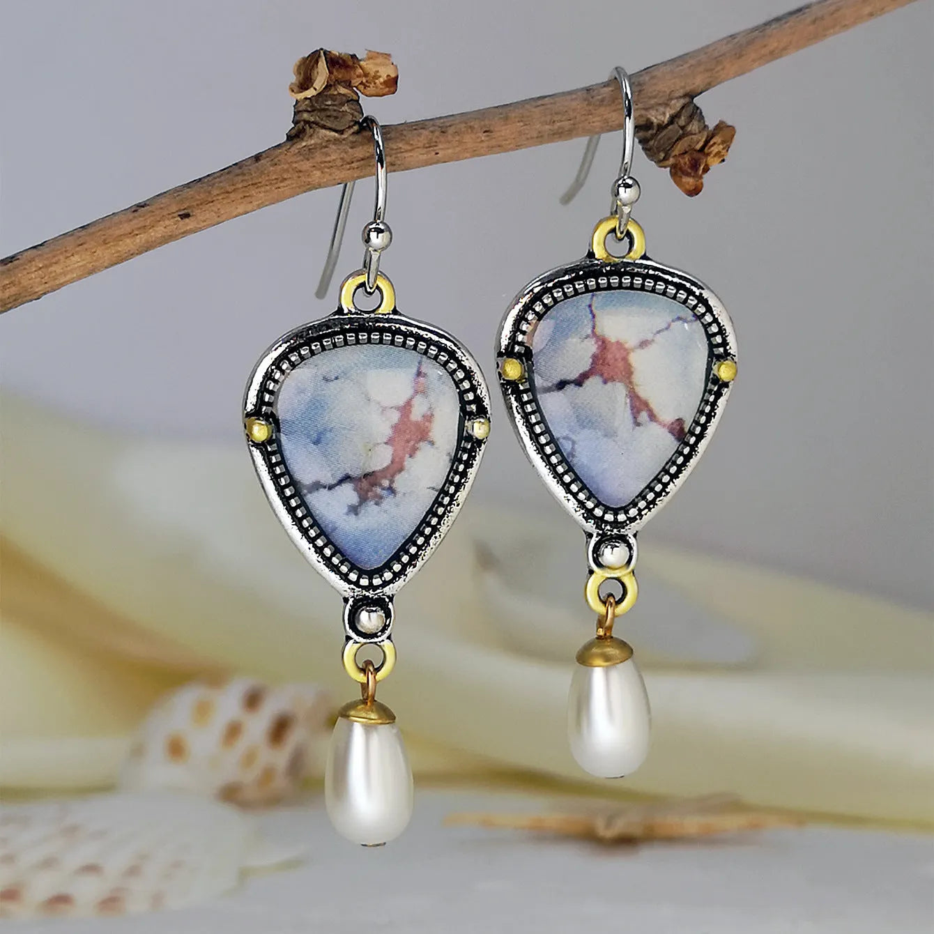 Retro blue drop earrings with electroplated metal, synthetic blue opal, and white pearl geometric design