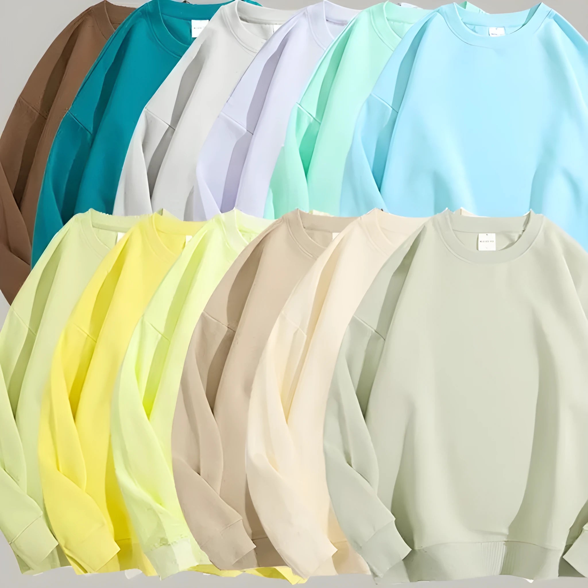 A loose-fitting, off shoulder, round neck cotton sweater in a solid colour with long sleeves.