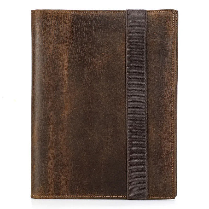 Brown Crazy Horse leather protective sleeve for an A5 paper notebook.