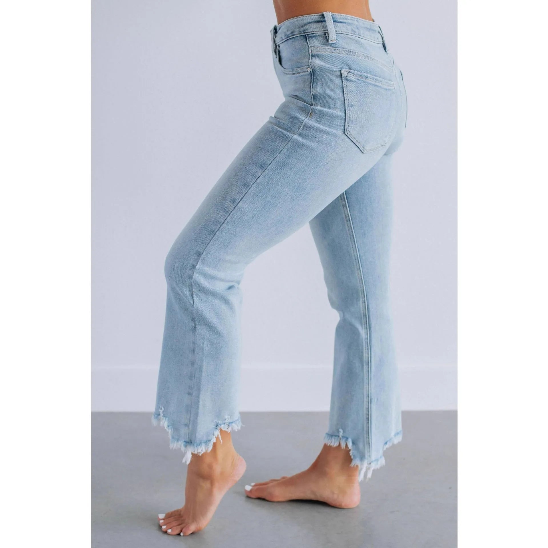 Women's casual denim pants with hand-worn distressing in dark blue or light blue solid colours
