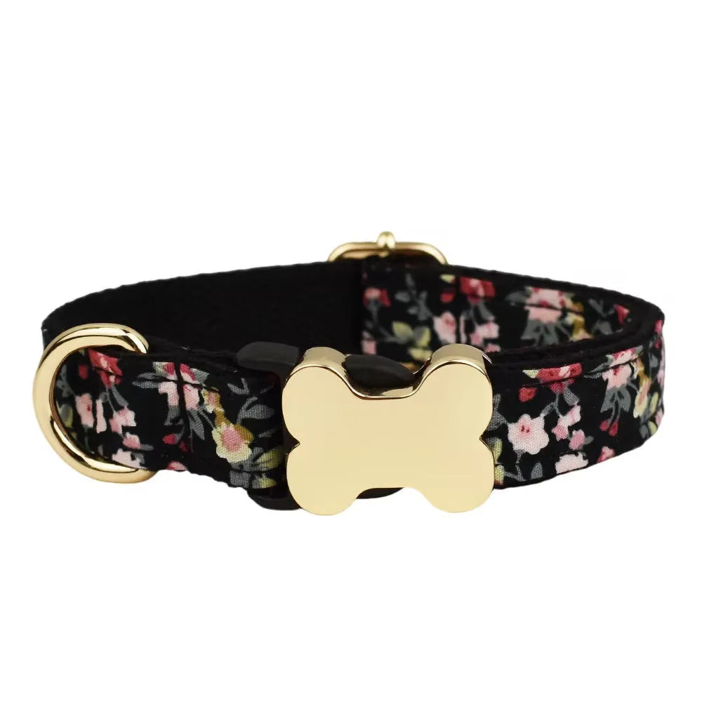 Flat nylon dog collar with grid print and a bone-shaped metal buckle on a white background.