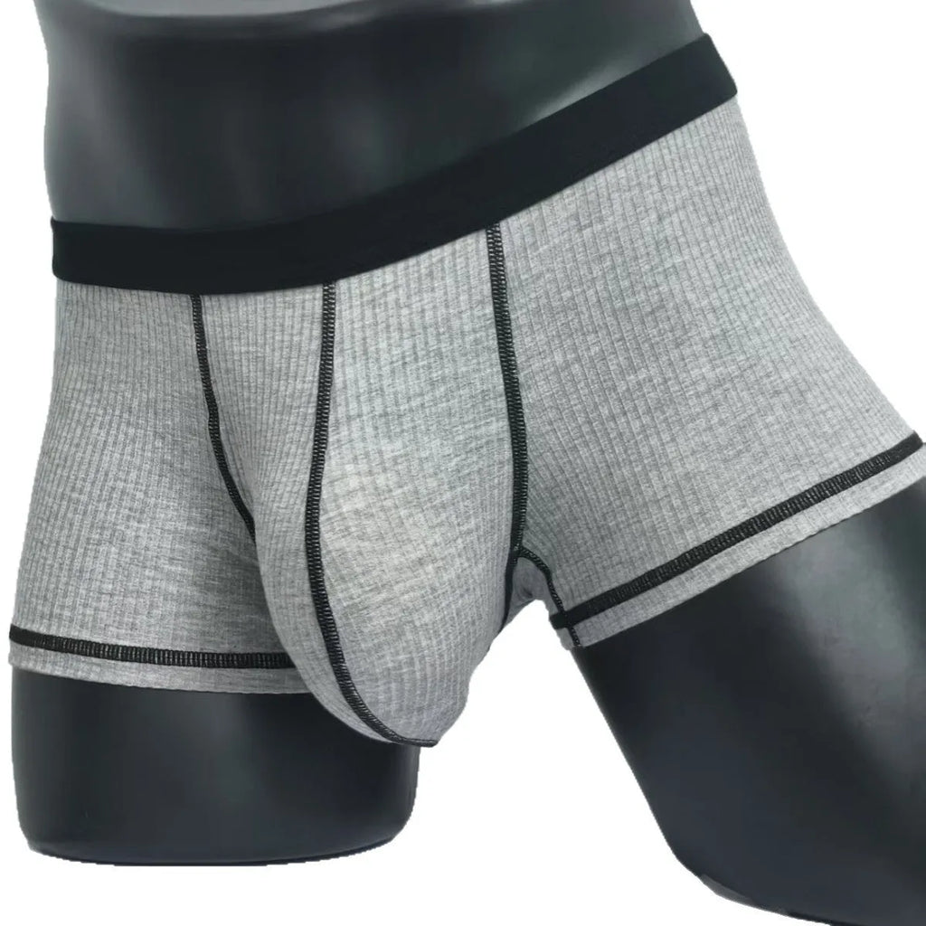Men's solid colour boxer shorts on a white background, showing thin breathable fabric.