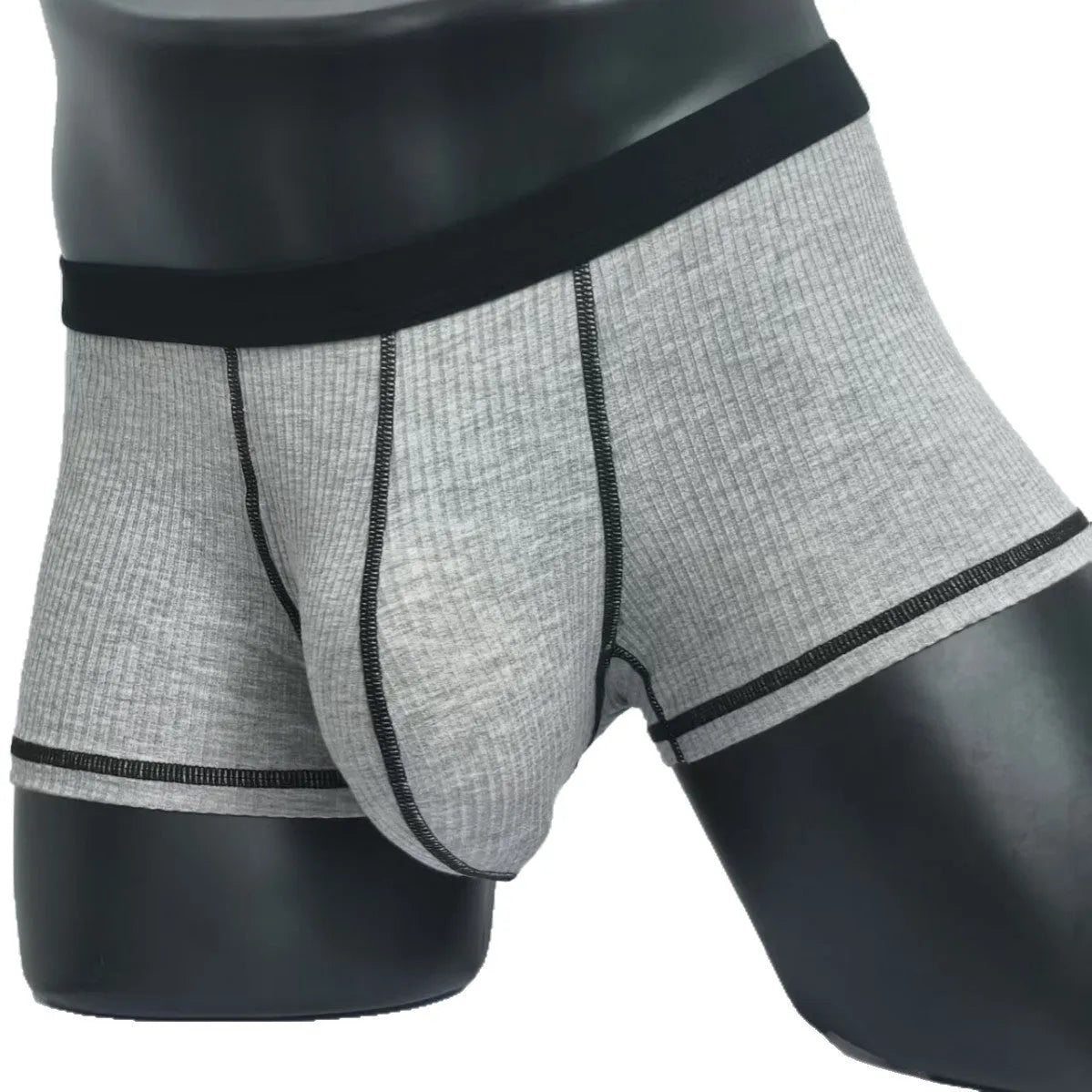 Men's solid colour boxer shorts on a white background, showing thin breathable fabric.