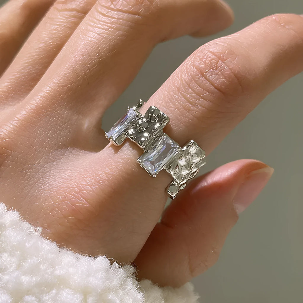 Silver cross zircon ring with open geometric design and three-dimensional decoration