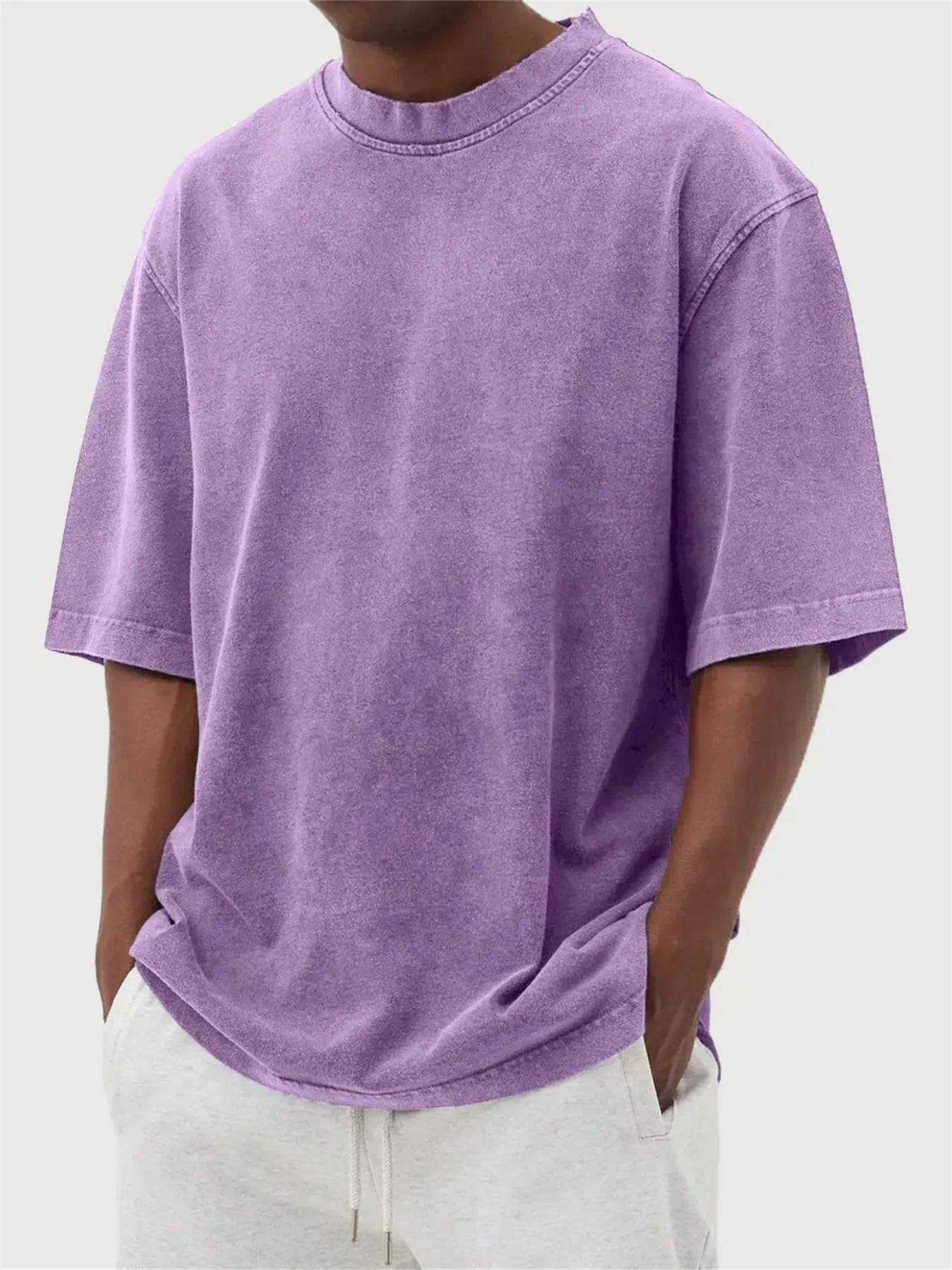 Men's washed distressed pullover t-shirt in solid colour with loose fit and stone washed finish