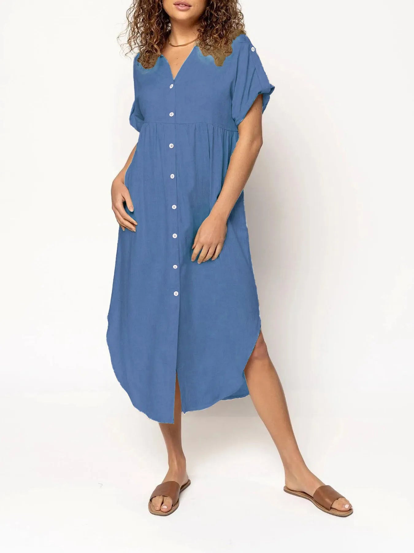 A woman wearing a casual solid-colour mid-length dress with a button-down front.