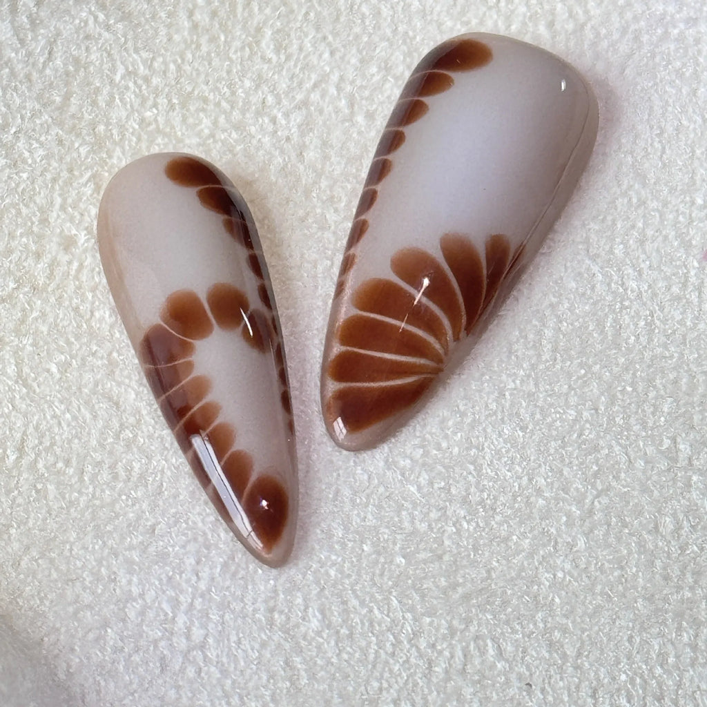 Set of long-tip nail stickers featuring leopard print, cross, and flower patterns in four sizes.