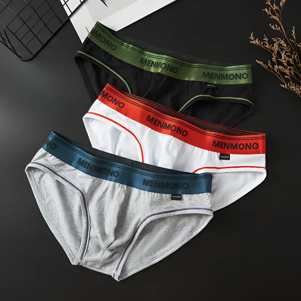 Men's low-waist cotton briefs shown in a two-tone colour combination, such as black with red trim.