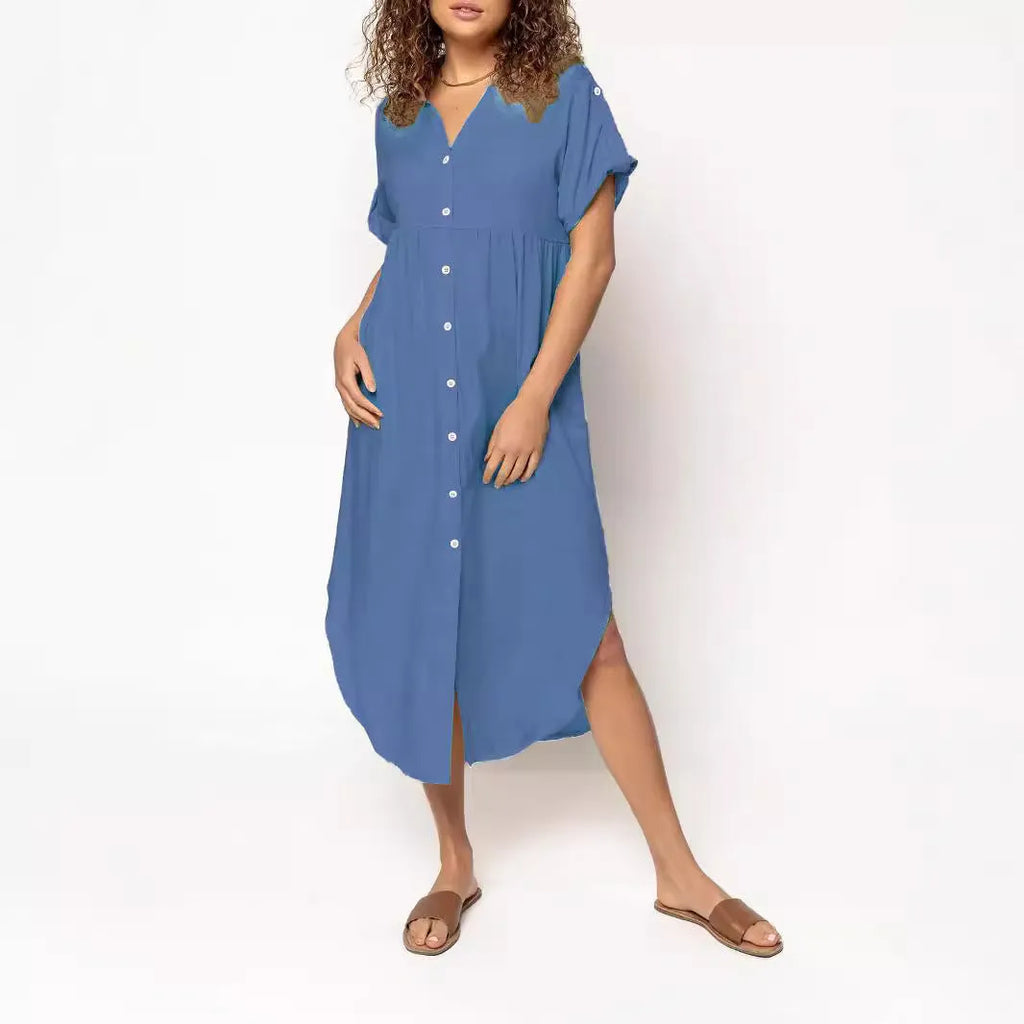 A woman wearing a casual solid-colour mid-length dress with a button-down front.