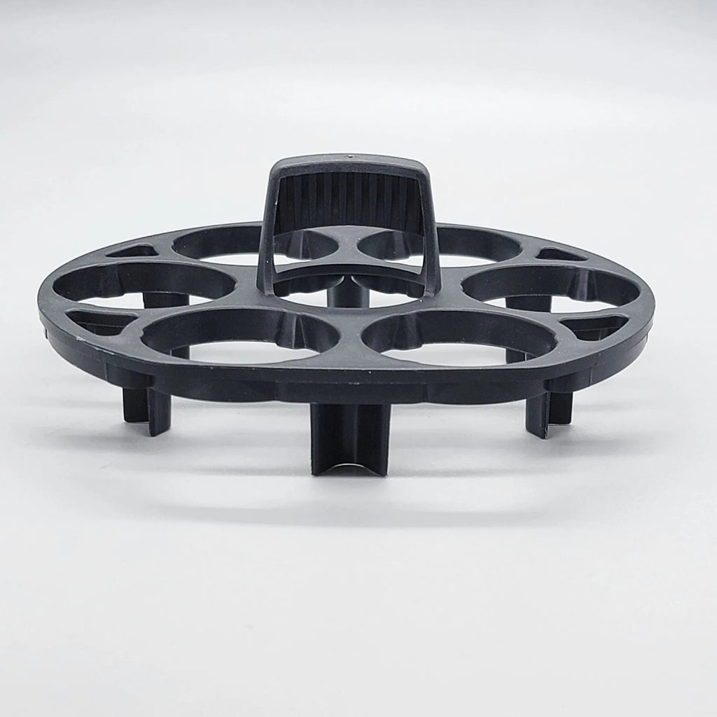 Black plastic egg holder rack with retainer for kitchen storage.