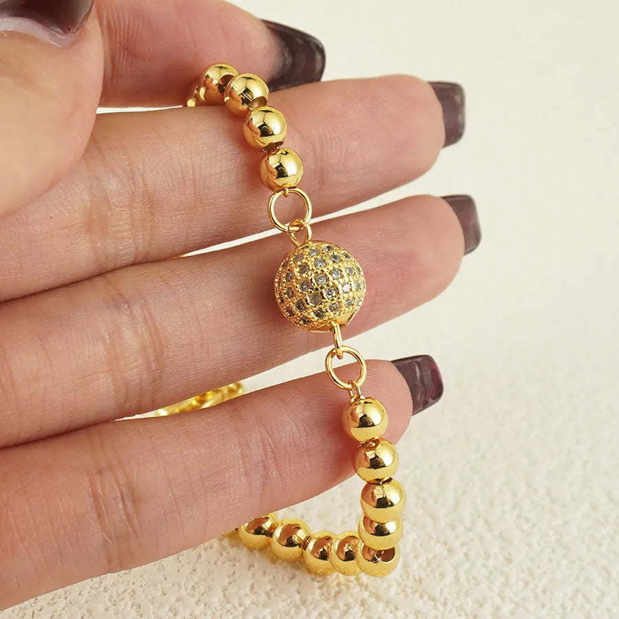 Copper bracelet with zircon beads and heart clasp in Arabic style design