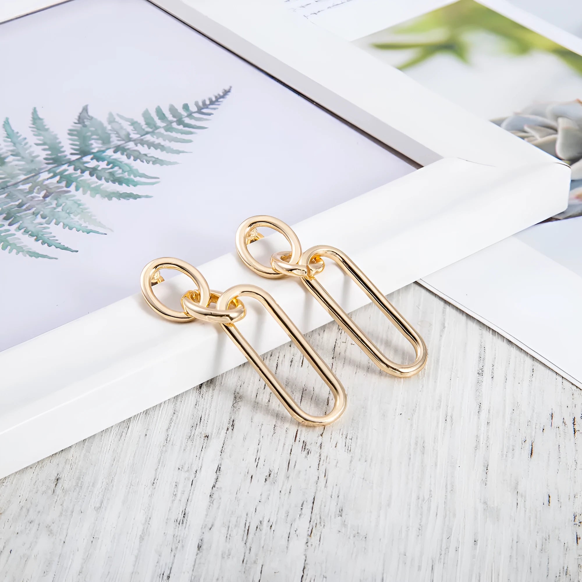 Sterling silver needle geometric hoop earrings with ring and line design elements