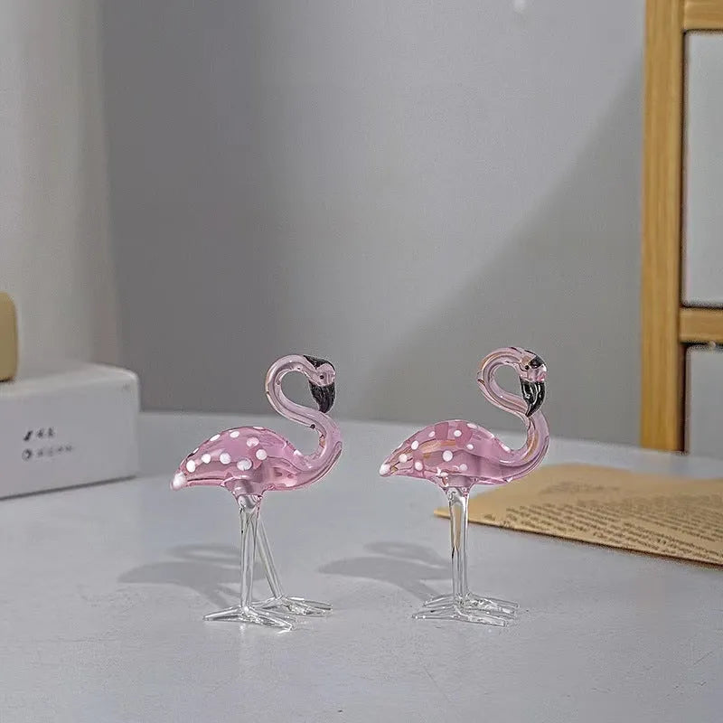 Pink crystal flamingo decorative ornament on table, available in separate or parallel styles.