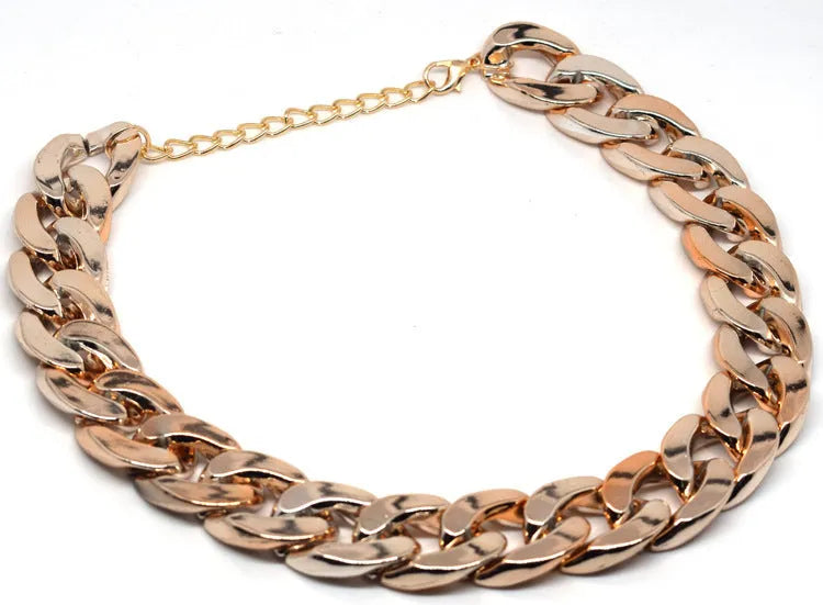Geometric twisted chain dog collar in gold colour with plastic/resin construction for small-medium pets